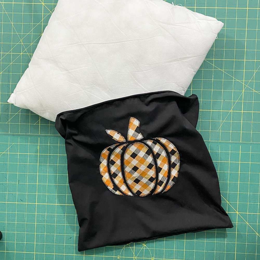 Turn pillow cover right side out and insert pillow form
