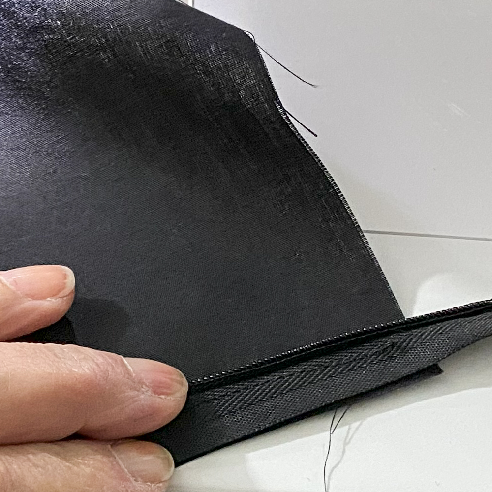 Roll zipper tape to sew close to zipper teeth